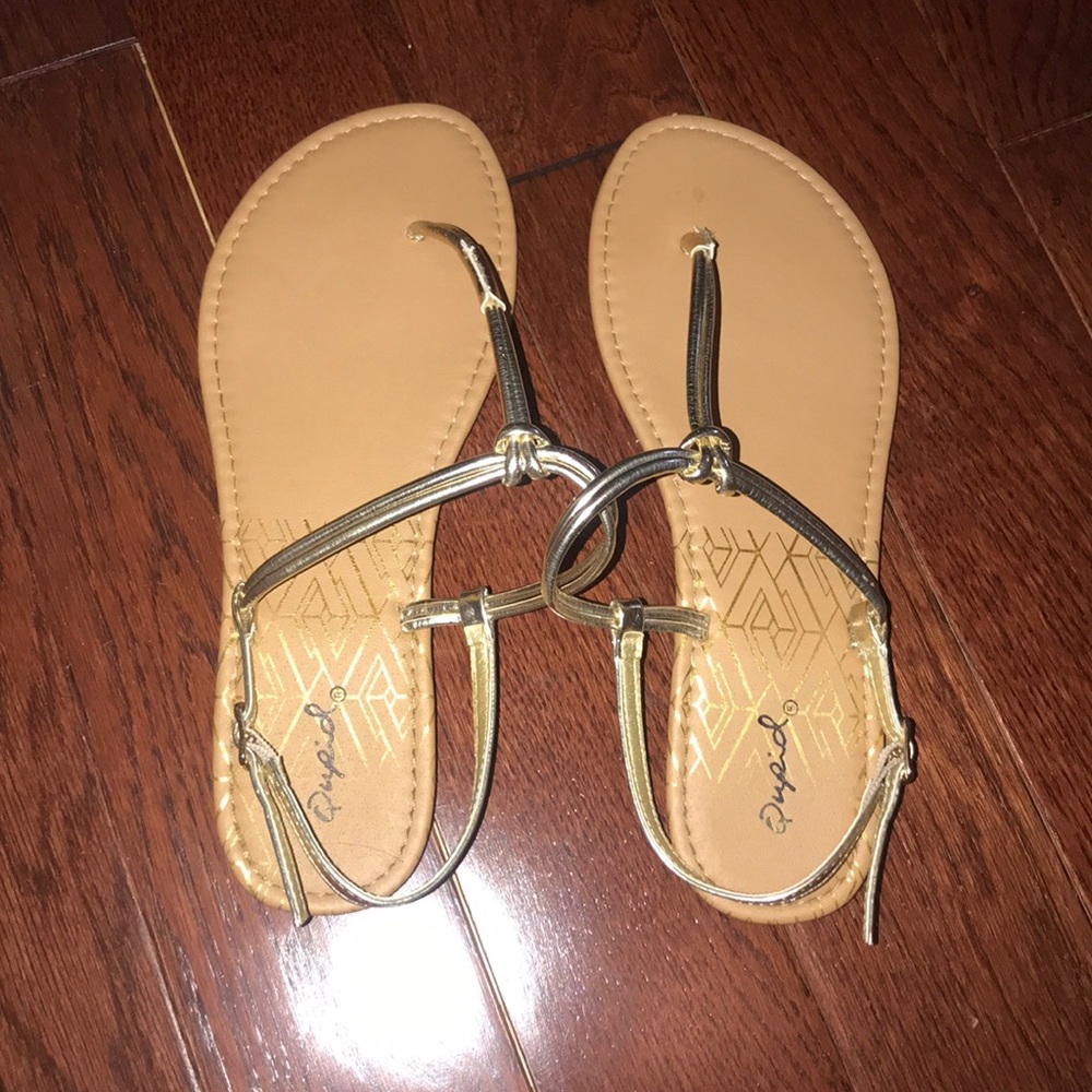 sandals with a gold knotted strap